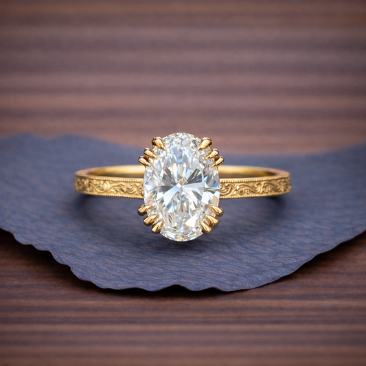 Gold ring with a large diamond on a textured surface