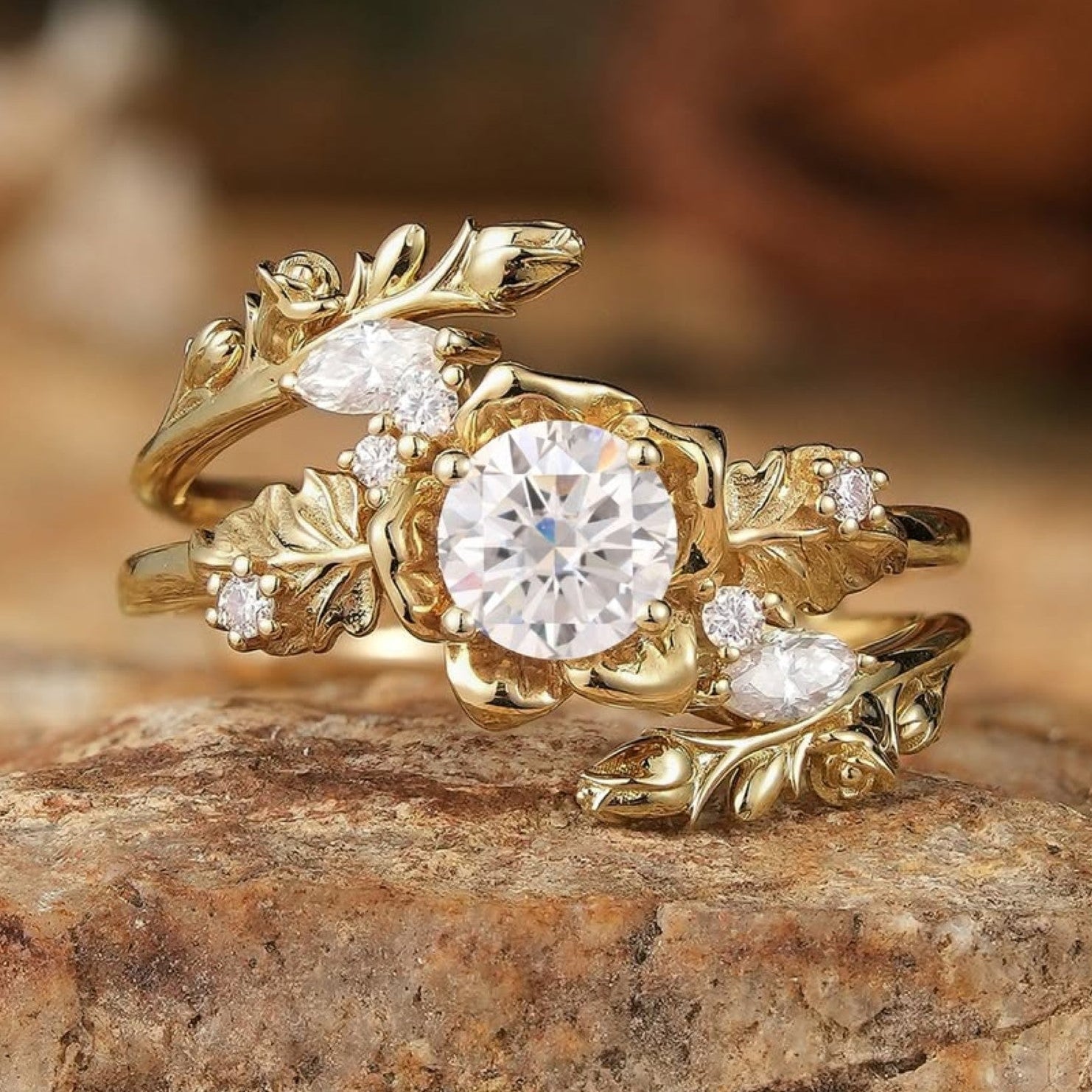 Gold ring with diamond on a stone surface