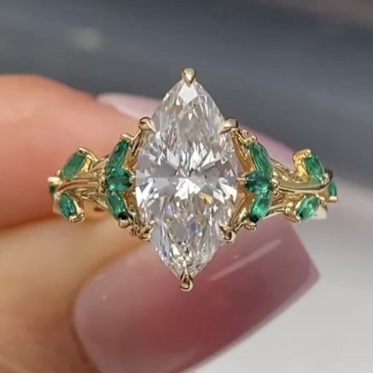 Marquise Cut Moissanite Diamond Floral Engagement Ring with Emerald Accents in Solid Gold Nature Inspired Vintage Design